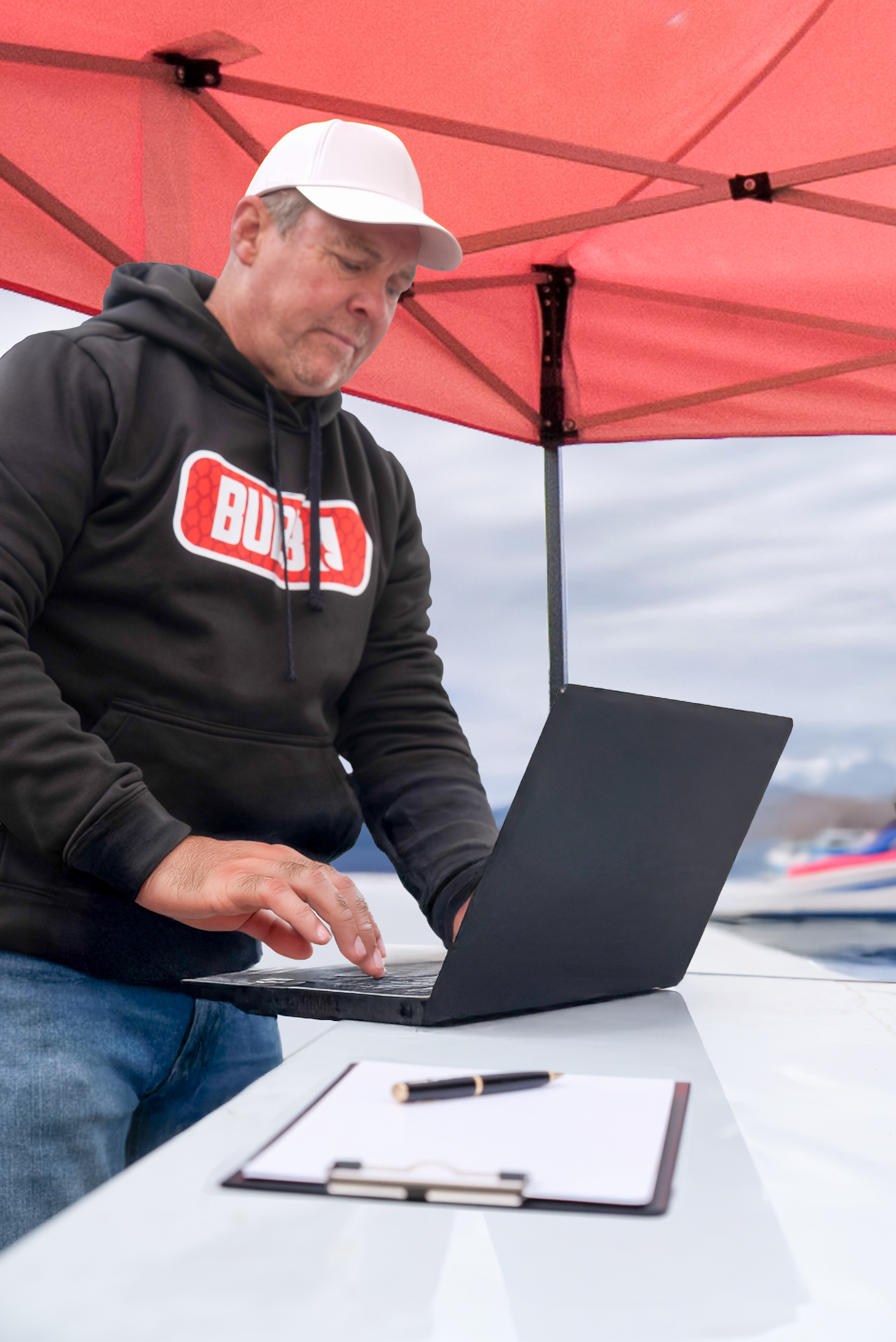 Tournament director managing live scoring at a BUBBA event