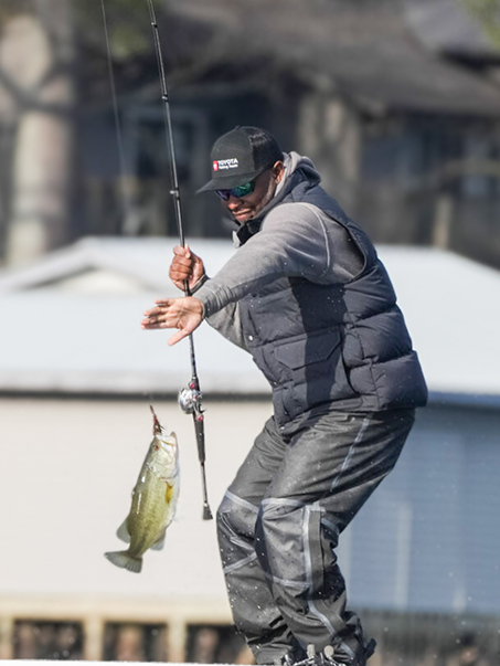 Angler catching a bass during a tournament